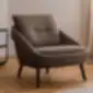 Nome fotelis iš NOTI, rudos spalvos audiniu, moderniame interjere.